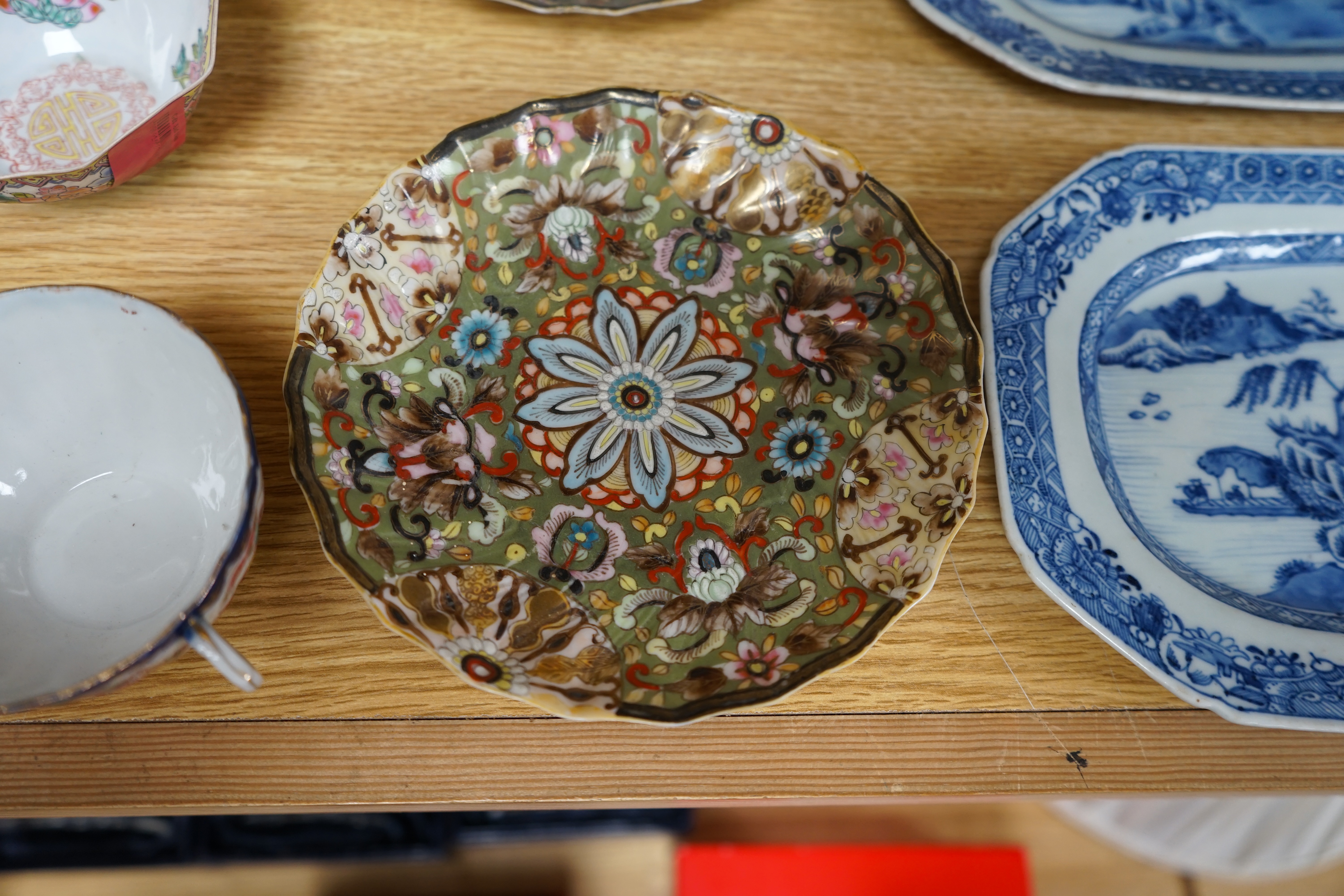 A quantity of Chinese and Japanese porcelain to include blue and white bowls, famille rose tea bowls and a pair of late 19th century dishes (18). Condition - varies, poor to fair